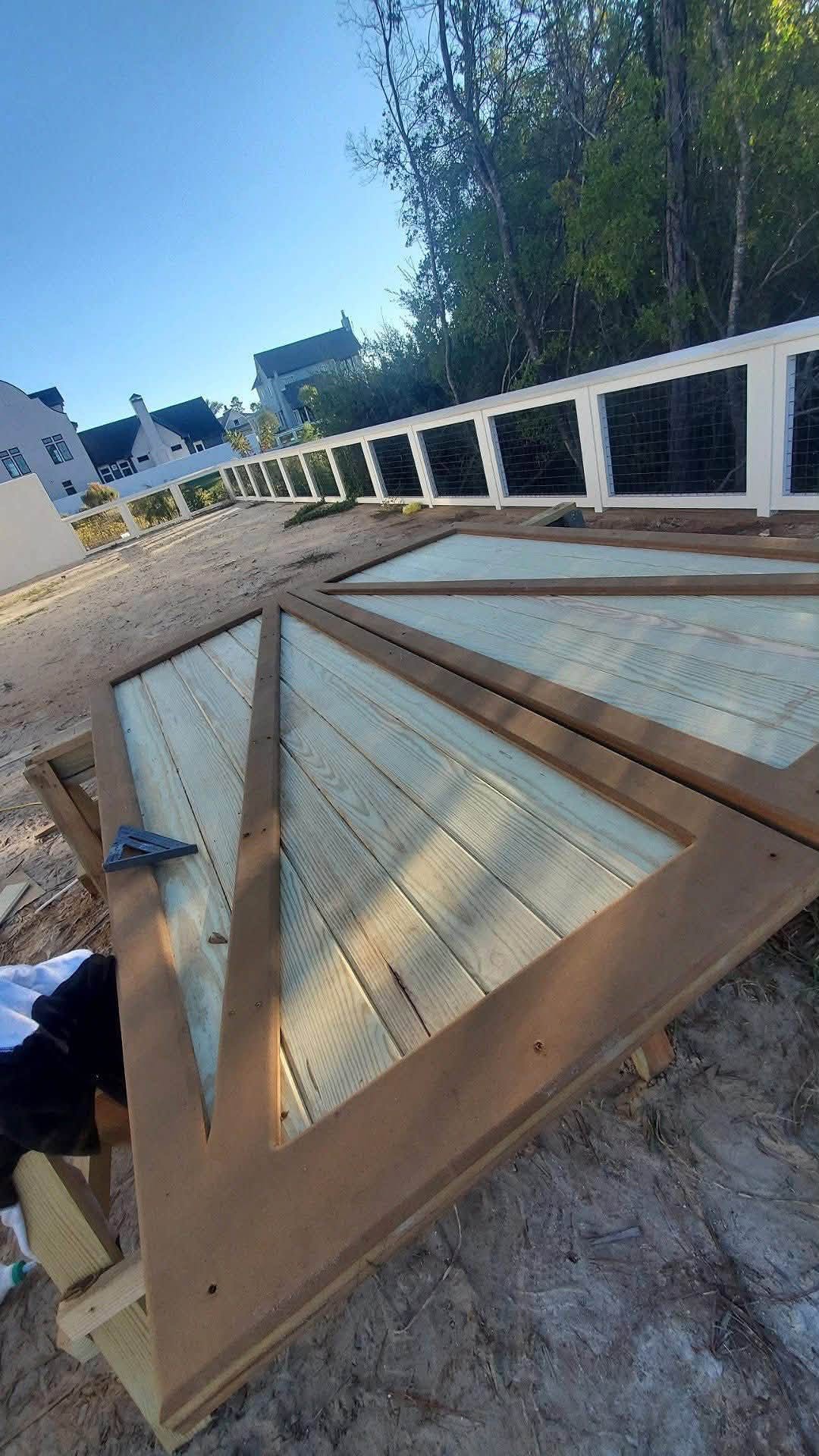 Handmade Z-brace gate doors under construction on site